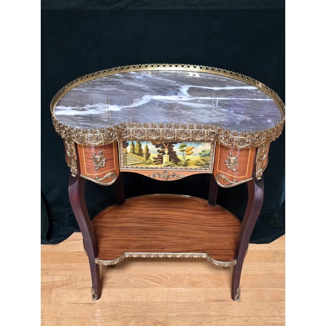Mid-Century Louis XV style wood kidney shaped end table with brass accents and embellishments with marble top, in original...