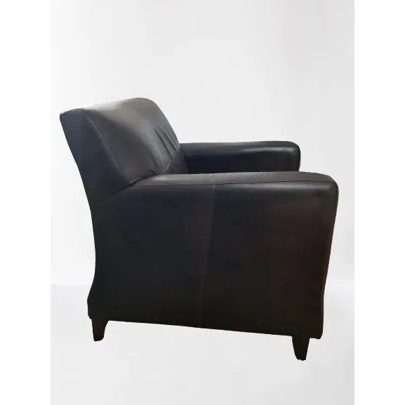 A beautifully crafted Bradington & Young brown leather chair that exudes timeless elegance and superior craftsmanship....