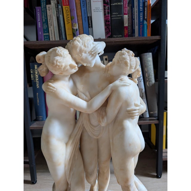 An exceptional and substantial late-19th-century Italian carved alabaster sculpture depicting The Three Graces...