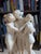 An exceptional and substantial late-19th-century Italian carved alabaster sculpture depicting The Three Graces...