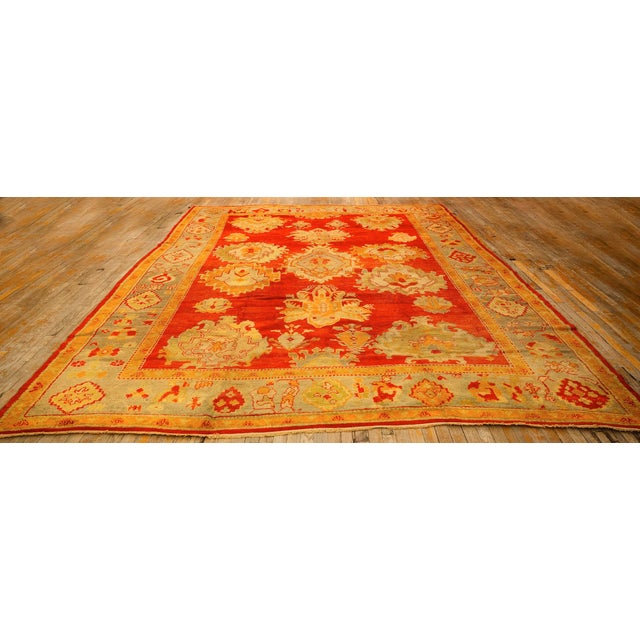 This late 19th-century Turkish Antique Oushak Rug features a hand-knotted wool, open-field design characterized by soft,...