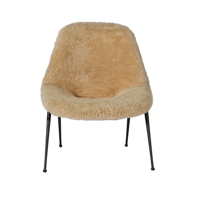 This high-back organic lounge chair from 1950s Italy features a refined, sculptural silhouette with a bucket seat shell...