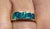 This is a stunning Tod Donobedian-designed 18k gold band with inset Australian opals. For the gentleman who appreciates...