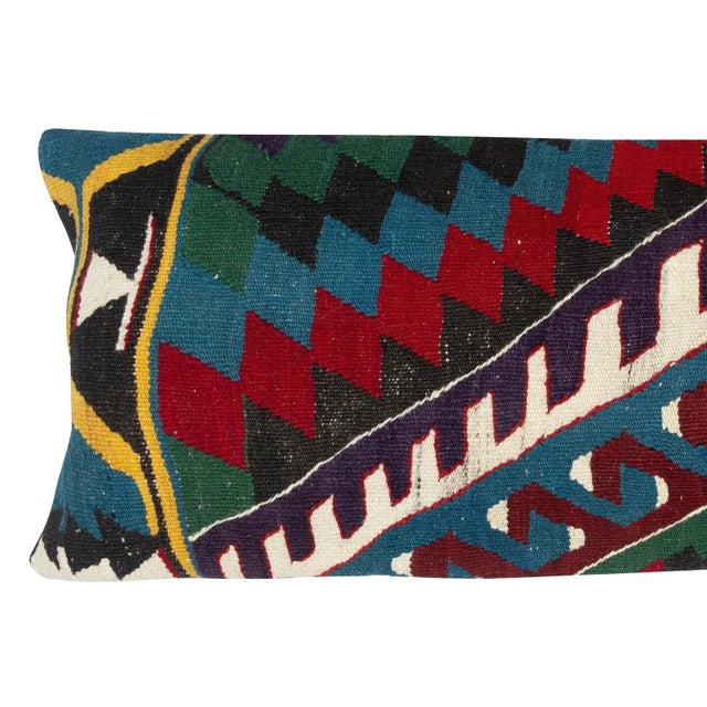 Add a touch of history and warmth to your space with this vintage handmade Turkish wool kilim cushion cover. Crafted from...