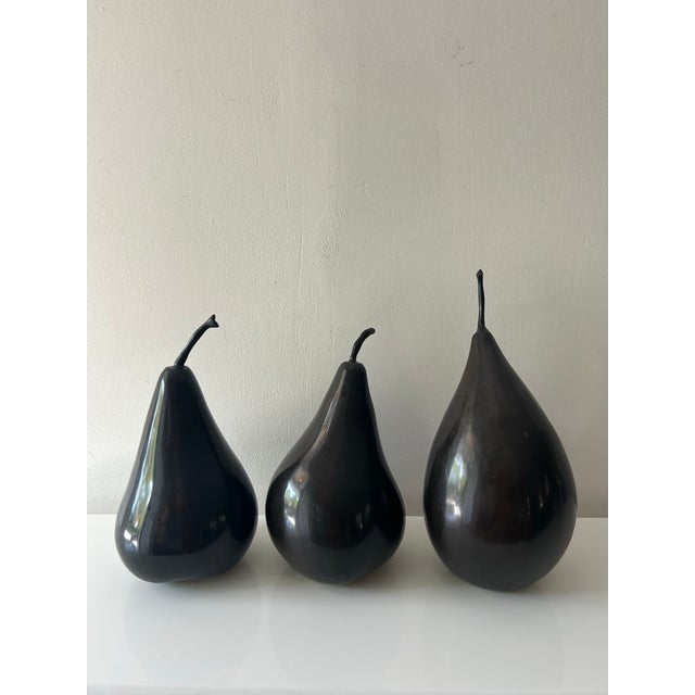 This trio of alternating forms and sizes of 3 abstract style bronze pear sculptures make a great ensemble that can be...