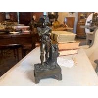 This finely detailed 19th-century French bronze statuette captures the iconic figure of Napoleon Bonaparte in a classic,...