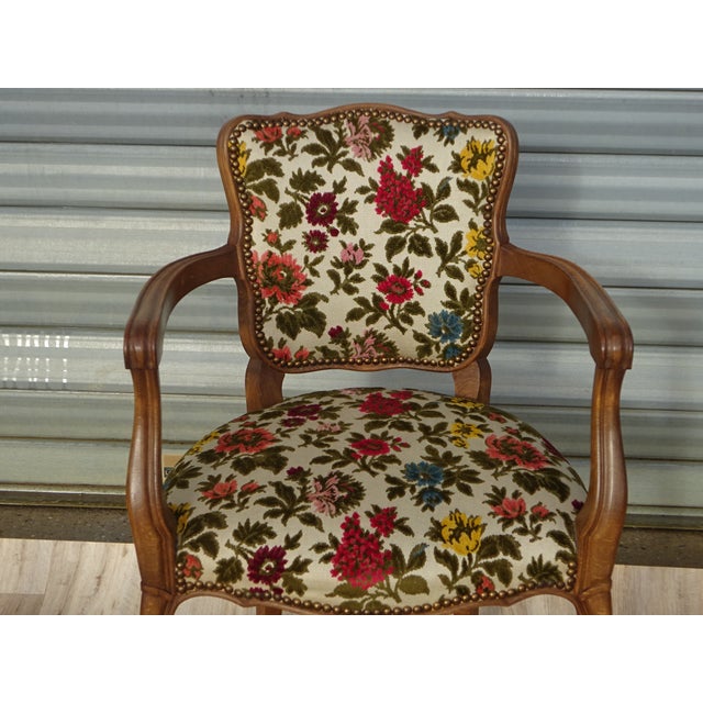 Louis XV style cabriolet armchair, solid beech frame with an oak stain. Brocatelle upholstery fabric with a pronounced...