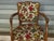 Louis XV style cabriolet armchair, solid beech frame with an oak stain. Brocatelle upholstery fabric with a pronounced...