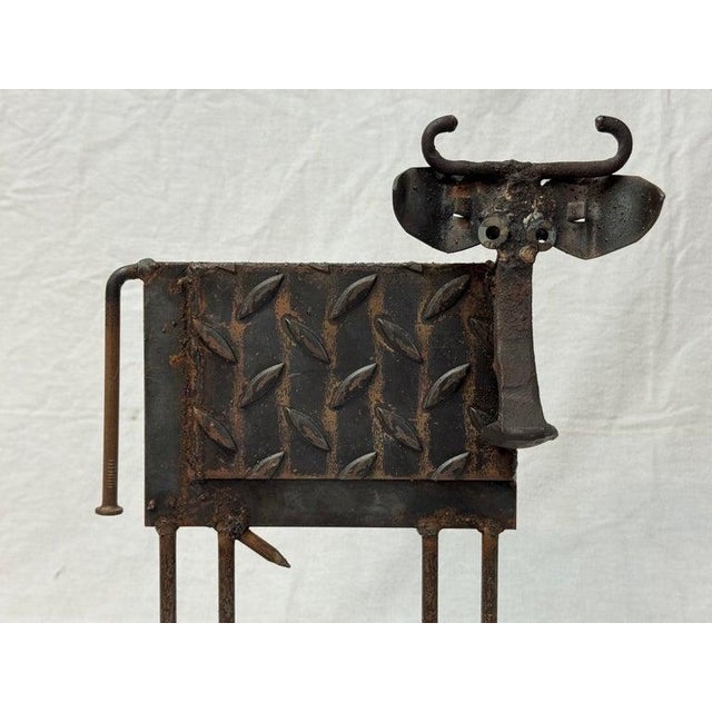 Whimsical Steampunk brutalist sculpture or door stop of a cow by Bill Heise, American (1943-2011). Iron and mixed metal...
