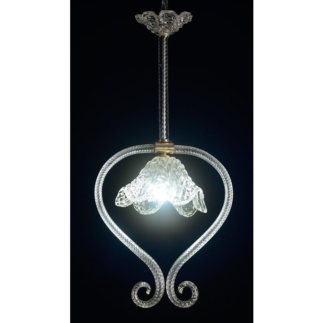 Pendant lamp by Barovier & Toso, hand blown, with brass fittings. The chandelier is 80 cm high, 35 cm wide. The fixture...