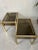 Two sturdy side tables with a gold-colored metal frame and 2 fumigated glass shelves. Glass in excellent condition. Robust...