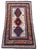 A beautiful little antique Kazak rug, woven in the Caucasus mountains of modern day Azerbaijan circa 1920. It features a 3...