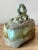 Presenting an extraordinarily unique vintage lidded box, a compelling piece of studio pottery that artfully blends...