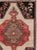 This Mid-20th century Turkish Anatolian room-size carpet presents a bold compartmentalized composition arranged in four...