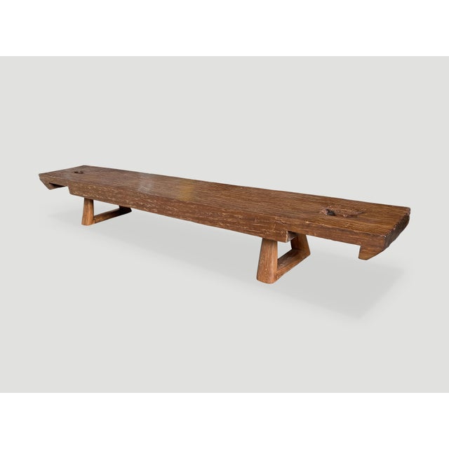 Beautiful single carved teak bench with a five inch thick top. Added triangle style base and cut out ends. A natural oil...