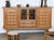 Danish oak sideboard with leaded glass doors, attributed to Henning Kjærnulf, Denmark, 1960s. The case is constructed in...