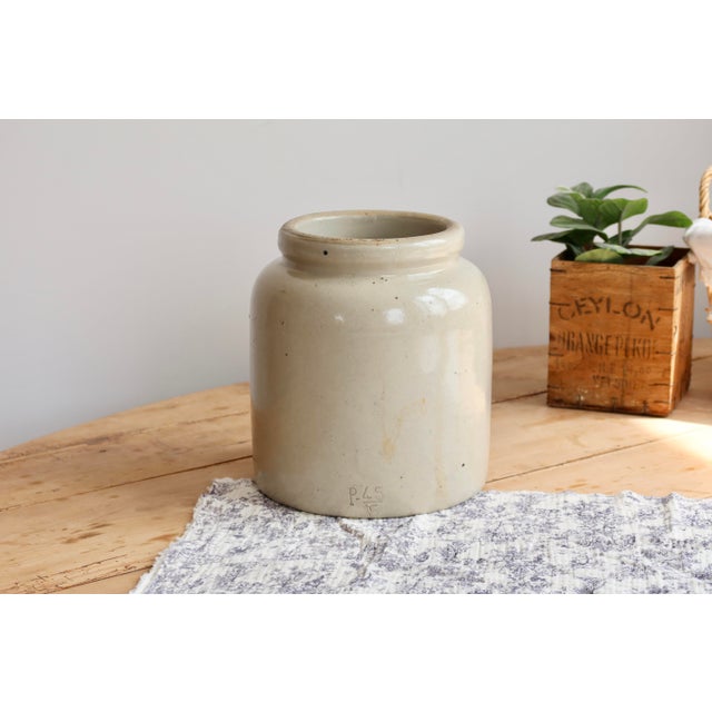 Beautiful and large antique stoneware jar in a soft taupe-beige hue, generously sized. Formerly used as a preserve pot,...