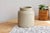Beautiful and large antique stoneware jar in a soft taupe-beige hue, generously sized. Formerly used as a preserve pot,...