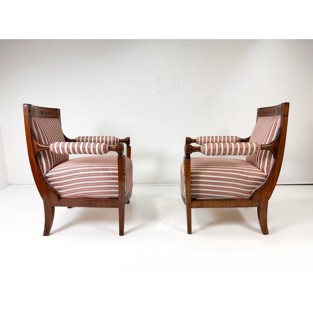 Pair of Early 19th Century Empire Armchairs. Mahogany with Brass details and inlays. Sweden. Matching Sofa available.