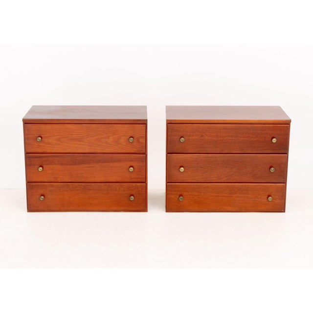 Pair of Modern Cherry-Stained Wood Chests of Drawers, each with three drawers and brass pulls. 24" H x 30" W x 16.25" D....