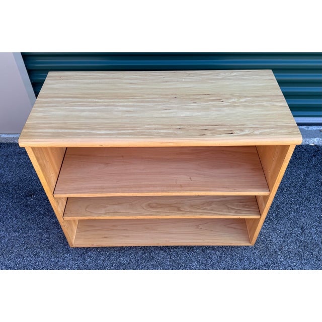 Bring timeless Mid-Century Modern style into your home with this vintage light elm wood shelf designed by Jack Cartwright...