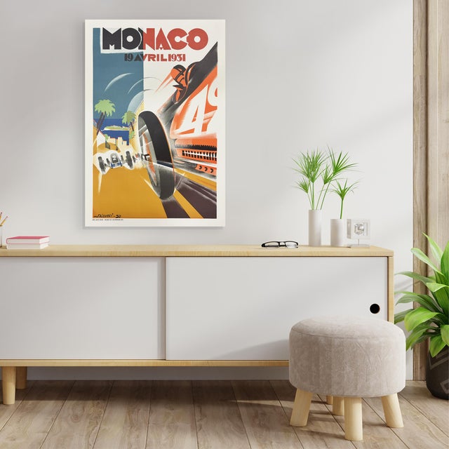 Reproduction lithograph poster of the 1931 Monaco Grand Prix illustrated by French artist Robert Falcucci. Measures 26.75"...