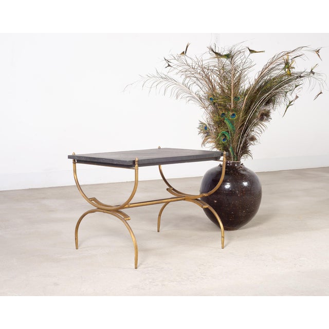 Opulent Italian mid-century modern coffee cocktail table made in the neoclassical style and manner of Maison Jansen. The...