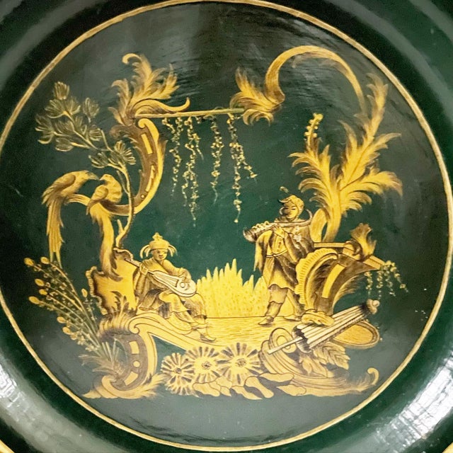 A magnificent papier-mâché tray done in a beautiful dark green, handpainted Asian scene in gold and black. This tray is...