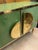 Contemporary Italian green Murano glass sideboard handcrafted in 2026 with polished brass fittings, handles and trim. The...