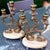 Vintage set of Louis XV style marble and bronze candlesticks or candle holders, circa 1930. Set on a beautiful pinkish-...