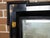 A Dutch faux tortoise black wall mirror from the 19th century with amber accents, carved frame and protruding corners....