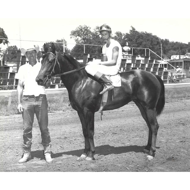 July 1965 black and white photograph of Cajun Joy in the winner's circle at Marble Downs in Carthage, Missouri. Jockey...