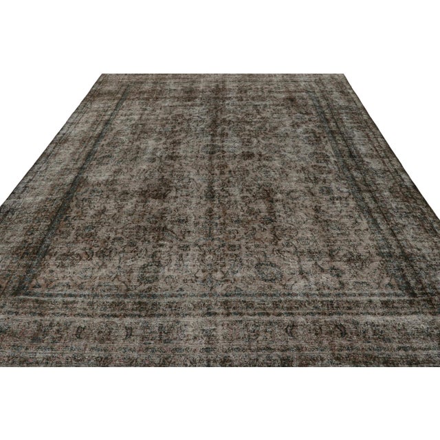 From our new collection of overdyed rugs, a vintage 9x12 Persian rug originating circa 1970-1980 or possibly earlier. On...