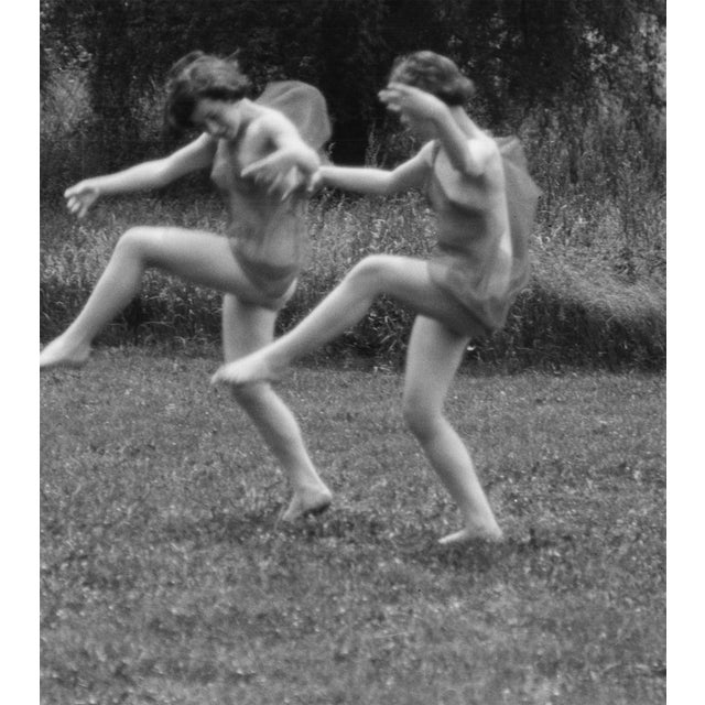 A charming, playful scene with two young modern dancers from Elizabeth Duncan's dance school. Elizabeth was Isadora's...