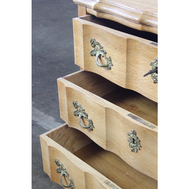An exquisite piece of 20th-century craftsmanship, this Danish oak chest of drawers masterfully blends the ornate elegance...