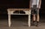 A late 19th century farmhouse kitchen table featuring a pine plank top with original distressed finish and a painted base...