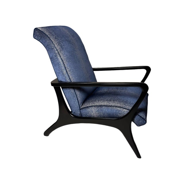 Gorgeous, freshly upholstered, with fabric reminiscent of looking at the stars. Frame is wood with glossy black finish....