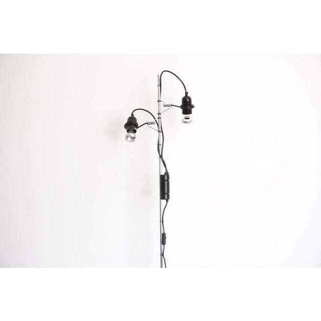 This striking vintage floor lamp was produced by Meblo, Yugoslavia, as part of a collaborative collection with Guzzini,...