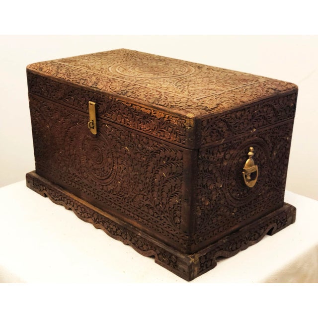 This hand-carved box in solid teak was made in Rajasthan during the early 20th century and is richly decorated with...