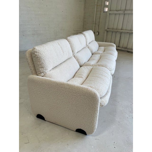 Gorgeous curves on this designer Italian sofa circa 1970's. Newly upholstered in trending nubby boucle, contrasts the...