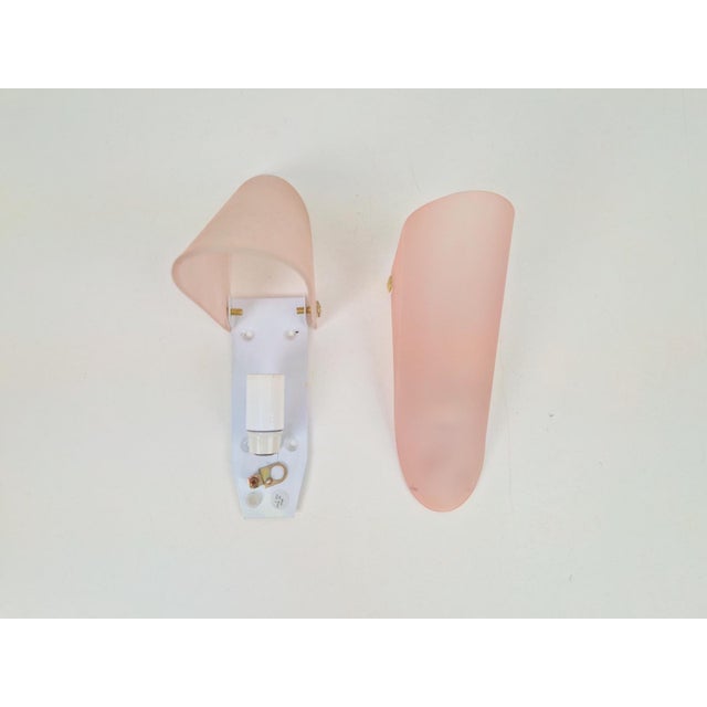 Pair of Minimalist Pink Frosted Glass Triangular Conical Wall Sconce Lamp, 1990s Minimalist wall sconce made in Italy....