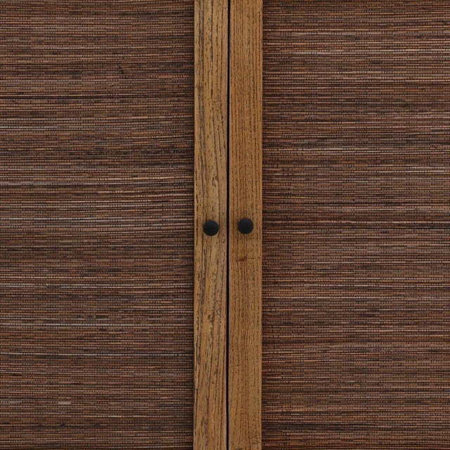 Modern tropical style Mindi wood frame four-door sideboard with coconut leaf rattan woven doors and sides. Doors open to...