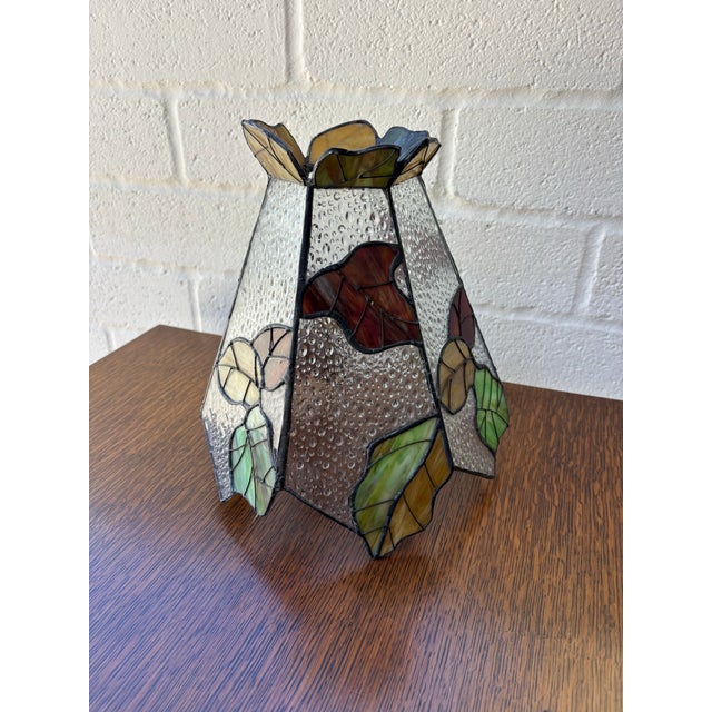 Vintage stained glass lamp shade with a vibrant fall leaf pattern. Excellent condition. No chips or cracks. H: 10 inches...