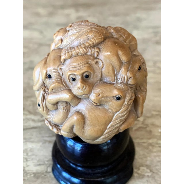 An antique Okimono (Japanese means artsy display ornament object) displayed on a small custom wood stand from Meiji Period...