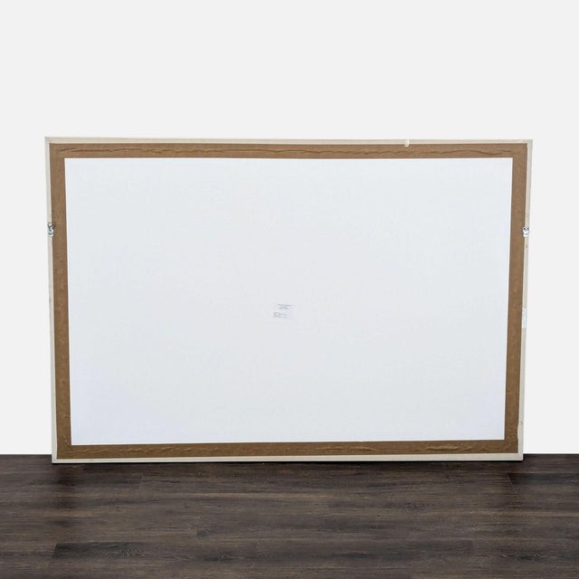 This Maker & Moss painting features bold, flowing blue brushstrokes on a white background, creating a modern abstract...