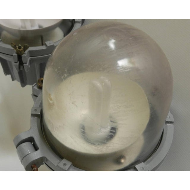 This is a set of three solid robust industrial bulk head lights with explosion-proof glass domes were originally designed...