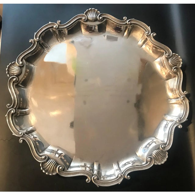 Large circular tray. Italian 800 silver. Scroll and shell border 13 1/2". 908 grams. Very good condition with minor...