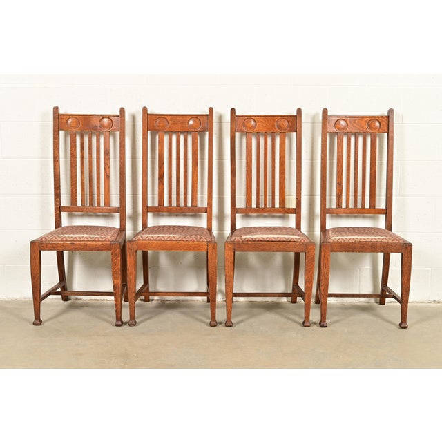 A fantastic set of four antique English Arts & Crafts high back dining chairs In the manner of Stickley Brothers England,...