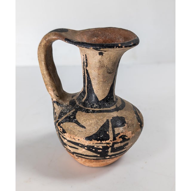 We are selling this nice small Native American Indian pottery pitcher. We believe this pitcher or ewer to be from the...