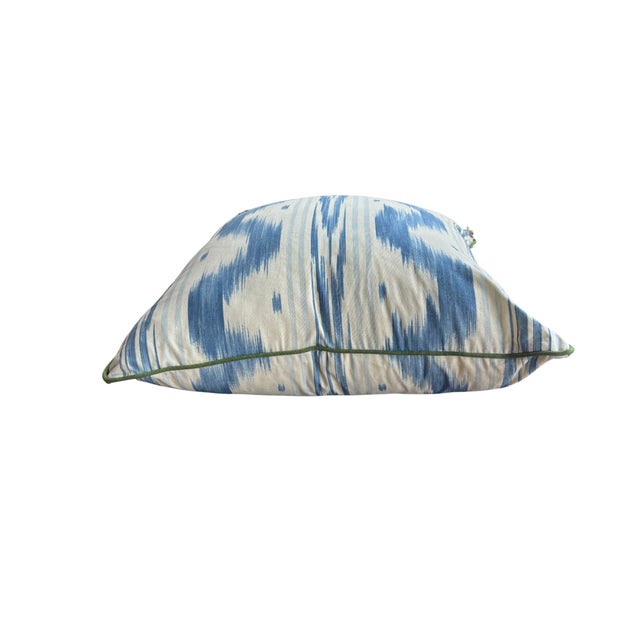 The Pierre Frey Toile de Nantes pillow features a blue and cream stipple ikat pattern on 100% cotton french fabric,...